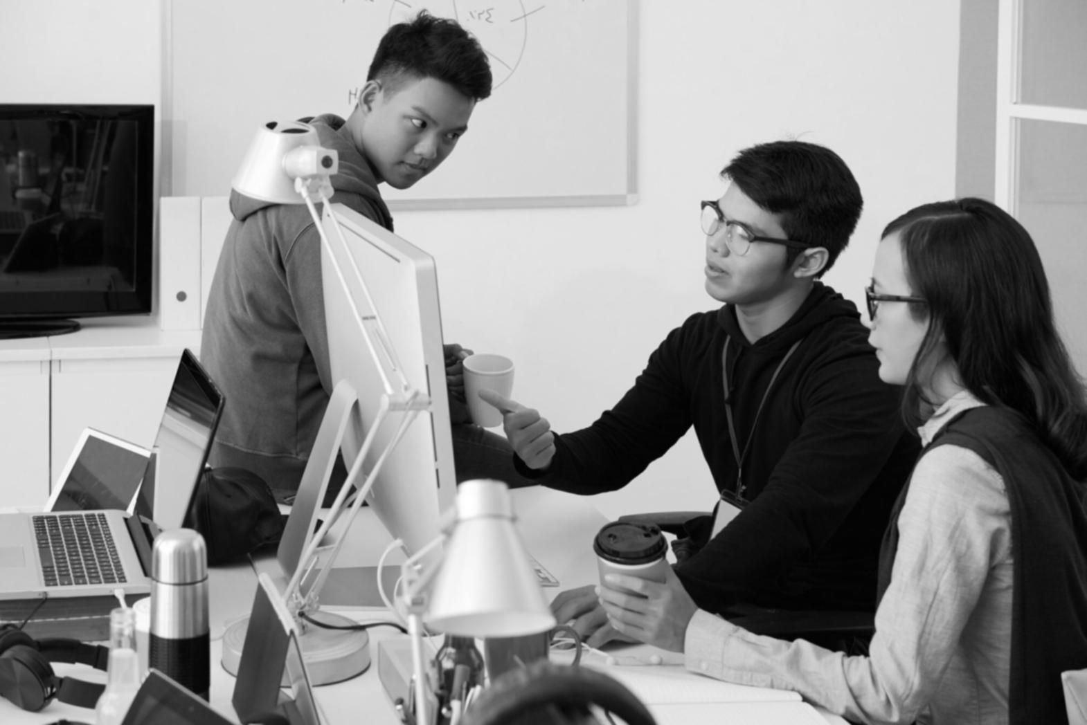 Mobile app development team working on code optimization